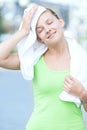 Tired woman after fitness time and exercising in city street par Royalty Free Stock Photo