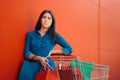 Tired Woman Having Back Problems while Shopping for Groceries Royalty Free Stock Photo