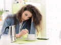 Tired woman having breakfast at home Royalty Free Stock Photo