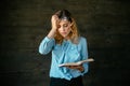 Tired woman holding a book