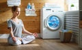 Tired woman housewife in stress meditates in lotus yoga pose in