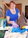 Tired woman irons clothes Royalty Free Stock Photo