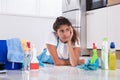 Tired Woman Lying On Kitchen Floor Royalty Free Stock Photo