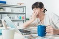 Tired woman at office desk Royalty Free Stock Photo