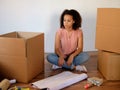 Tired woman preparing home relocation