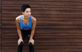 Tired woman runner breathing, taking run break Royalty Free Stock Photo