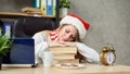 Tired woman working on laptop at christmas time. business lady at work Royalty Free Stock Photo