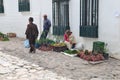 Tired woman selling goods in Villa de Leyva, Colombia