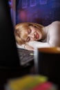 Tired woman sleeping at her desk while working overtime Royalty Free Stock Photo