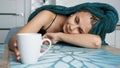 Tired woman sleeping on the table. Lazy sleepy morning