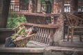 Tired woman sleeping in a wicker chair