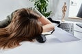 Woman sleeps at home office workplace, Overworking burnout Royalty Free Stock Photo