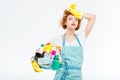 Tired woman in yellow gloves holding box with detergents Royalty Free Stock Photo