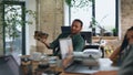 Tired workers waiting coffee break sitting office closeup. Man bringing beverage Royalty Free Stock Photo