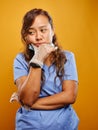 Tired and worn down filipina nurse portrait Royalty Free Stock Photo