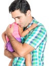 Tired and worried hispanic father carrying his small daughter