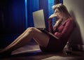 Tired wwoman using a laptop by night Royalty Free Stock Photo