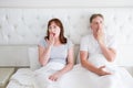 Tired yawn middle age couple in bed. Family life and healthy relationships. Health care and morning concept. Copy space