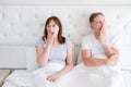 Tired yawn middle age couple in bed. Family life and healthy relationships. Health care and morning concept. Copy space