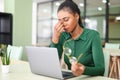 Tired young african-american female employee took glasses off and is massaging bridge of the nose Royalty Free Stock Photo