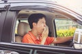 Tired young asia man driving his car Royalty Free Stock Photo