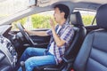 Tired young asia man driving his car Royalty Free Stock Photo