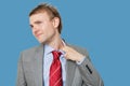 Tired young businessman loosening tie Royalty Free Stock Photo