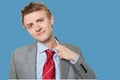 Tired young businessman loosening tie Royalty Free Stock Photo