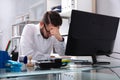 Tired Young Businessman Sitting In Office Royalty Free Stock Photo