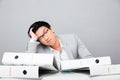 Tired young businessman sitting at the table Royalty Free Stock Photo