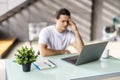 Tired young man feel pain eyestrain holding glasses rubbing dry irritated eyes fatigued from computer work, stressed man suffer Royalty Free Stock Photo