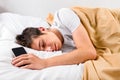 Young Man sleep with a Phone Royalty Free Stock Photo