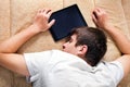 Young Man sleep with Tablet Computer Royalty Free Stock Photo
