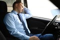 Tired young man sleeping in his car Royalty Free Stock Photo