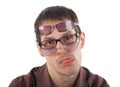 Tired young man wearing three glasses Royalty Free Stock Photo