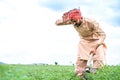 tired young village farmer busy working on farmland during monsoon cloudy day - conept of hardworking, traditional