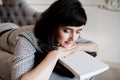 Tired young woman or Entrepreneur sleeping on sofa after long hours work on laptop, Overworked exhausted. businesswoman Royalty Free Stock Photo