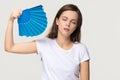 Tired young woman feel overheated suffering from heat waving fan Royalty Free Stock Photo