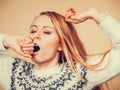 Sleepy yawning teenage woman in jumper