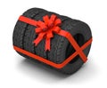 Tires as a gift. A set of four tires with a red gift ribbon with a bow. isolated on white background. 3d render