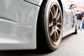 Tires of race car for driving. Drag and drift car with lower-profile tire. Racing low profile tyre with brake disc. Alloy wheel Royalty Free Stock Photo