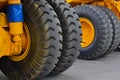 Tires with rims and electric motor-wheels engines of a yellow career dump trucks