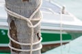Tires and rope tied to a coconut mooring mast ship. Royalty Free Stock Photo