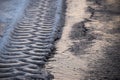 Tires tracks in melting snow Royalty Free Stock Photo