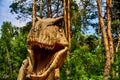 Tirex tyrannosaurus rex dinosaur eye. Large head of a lizard. Robotic model in the park.