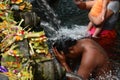 The ritual purifying bath in the temple pond. Tirta Empul. Tampaksiring. Gianyar regency. Bali. Indonesia