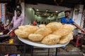 A big plate of deep fried puris at a street snack stall in the tourist town of
