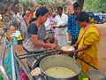 Beggars and Sadhus getting food in the Ramana Ashram in Tiruvanamalai in India