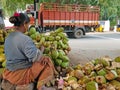 Preparing coconuts for sale in Tiruvanamalai in India