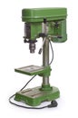 Green drilling machine on a white background.